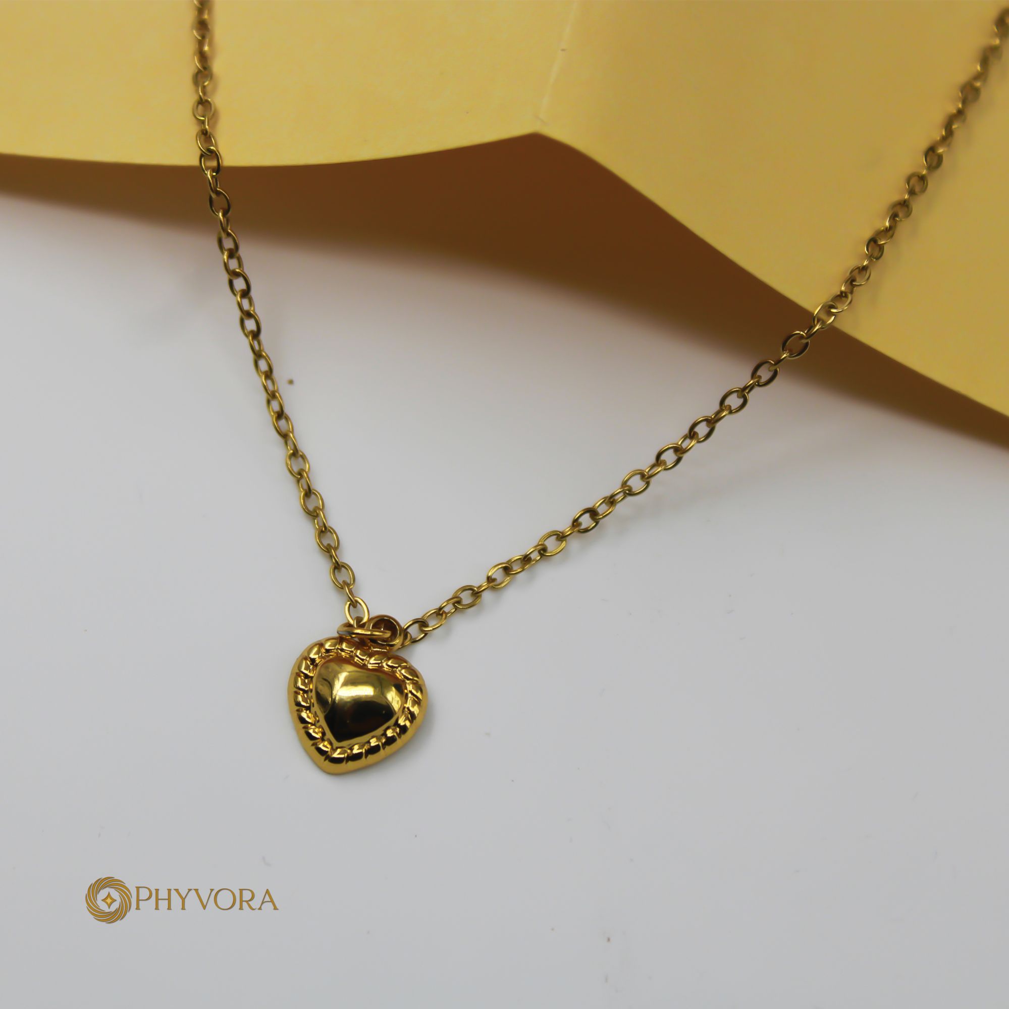 Embossed Gold Heart Pendant Necklace in Stainless Steel